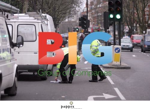 Metropolitan Police Officers Retrieve Documents From Busy Road