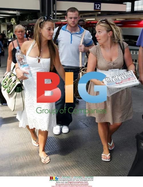 Wayne Rooney and Coleen arrive in London