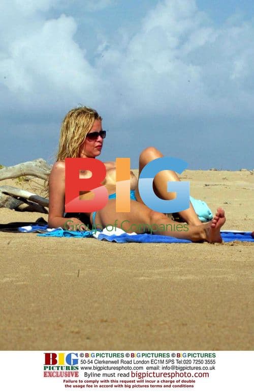 Alicia Douvall relaxes on Barbados beach