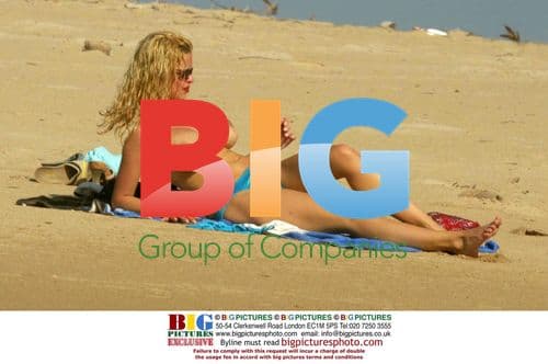 Alicia Douvall relaxes on Barbados beach