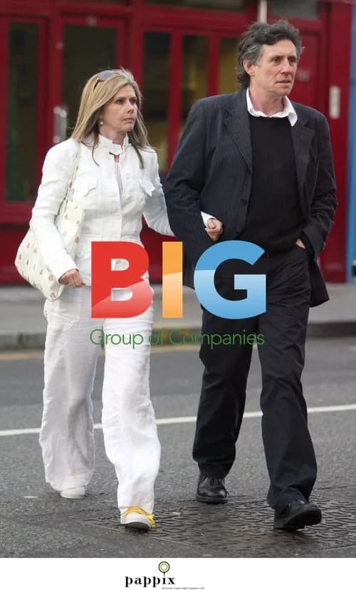Gabriel Byrne walks with girlfriend in London