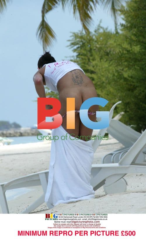 Sophie Anderton shows more than intended on Caribbean beach