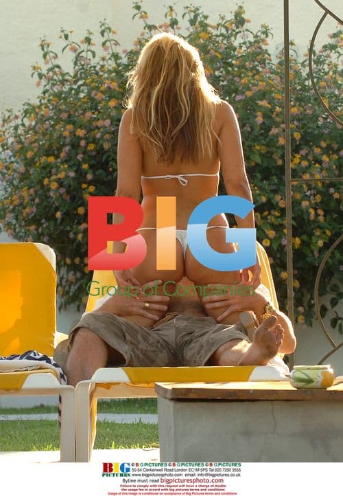 Glamour Girl Holly McGuire strips in Spain