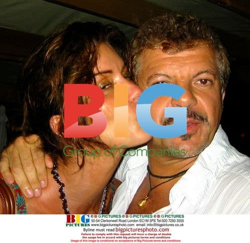 Janice Dickinson and Rocco Ancarola Kissing