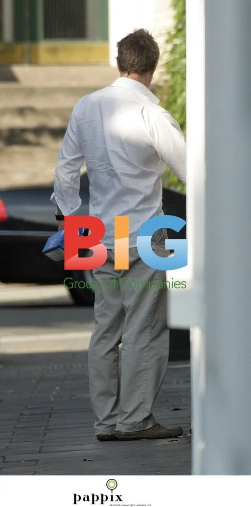 Hugh Grant Arrives Home with Prescription Bag