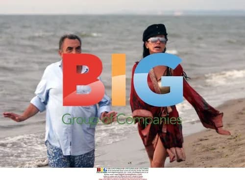 Nancy Dell'Olio and friend on beach
