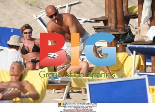 Footballer Gianluca Vialli relaxes on the beach