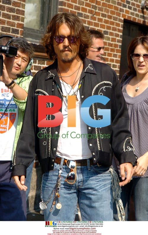 Johnny Depp Signing Autographs for Fans in NYC