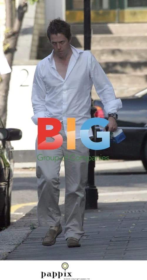 Hugh Grant Arrives Home with NHS Bag