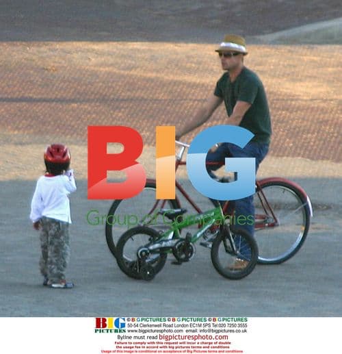 Brad Pitt Out with Maddox on a Bike Ride in Namibia