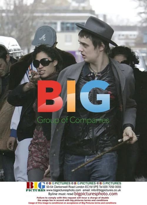 Pete Doherty and friends aim fake rifle at passersby