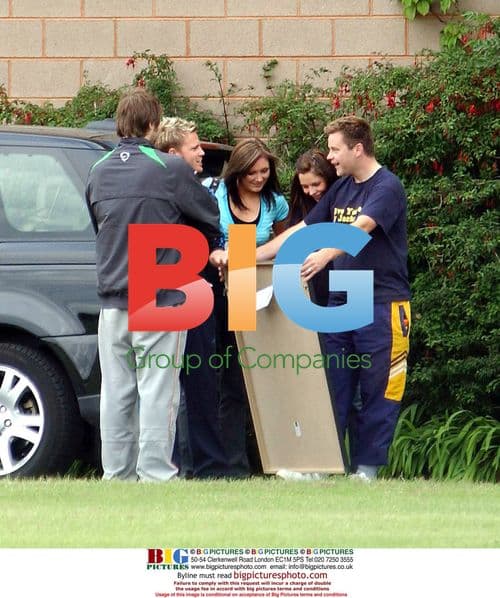 Nicky Byrne shows Brian McFadden Liverpool jersey