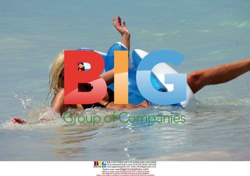 Emma B and Bryan Harvey frolic in Caribbean sea