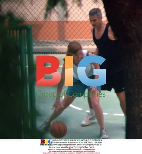 George Clooney plays basketball