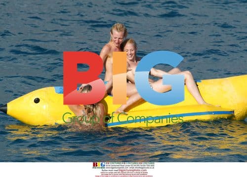 Glamour girls fool around on inflatable banana