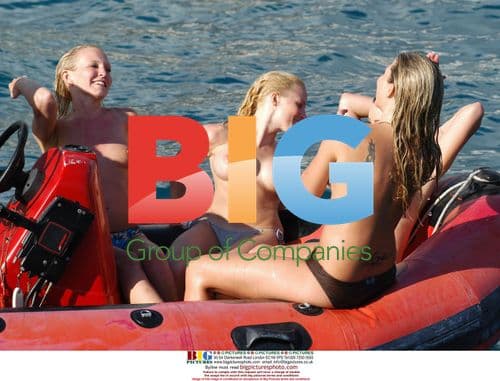 Glamour Girls Fool Around on Inflatable Banana