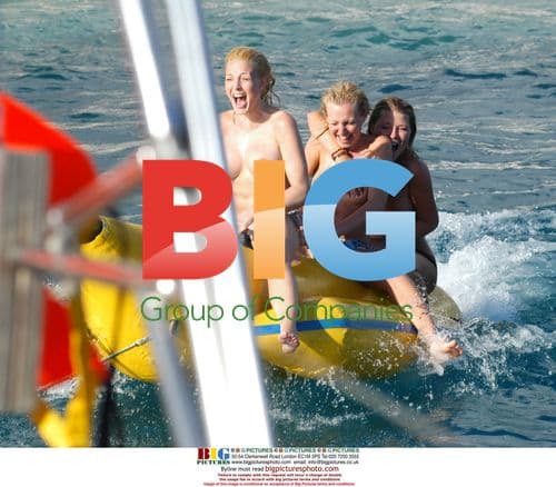 Glamour girls fool around on inflatable banana