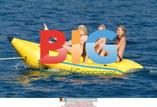 Glamour girls fool around on inflatable banana