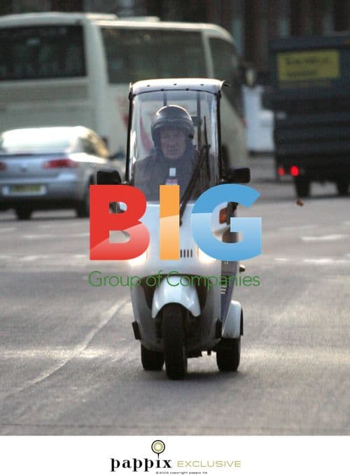 Sir Sterling Moss on 3-Wheeled Moped in London