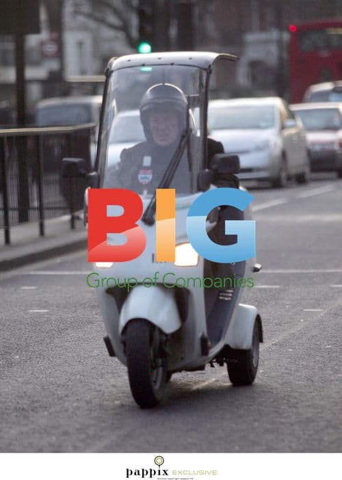 British F1 Legend Sir Sterling Moss on 3-Wheeled Moped