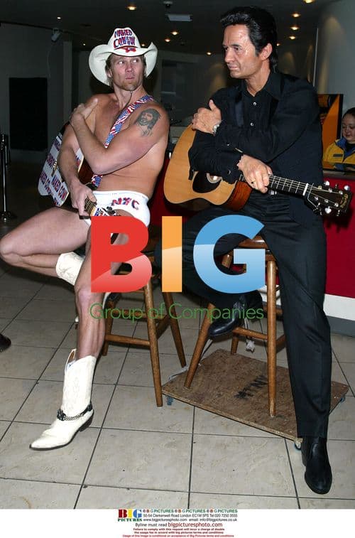 Johnny Cash wax figure debuts with Naked Cowboy