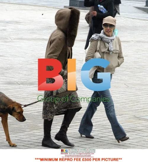 Kylie Minogue strolls in Paris with friend and dog