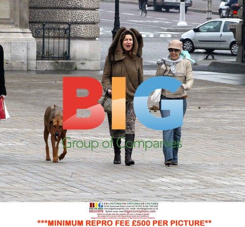 Kylie Minogue enjoys Paris stroll with friend and dog