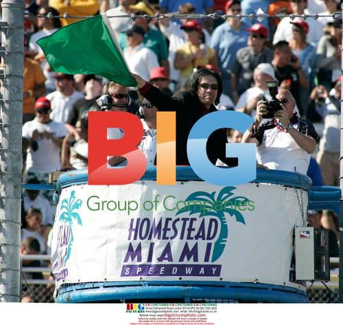 Gene Simmons waves green flag at Toyota Indy 300