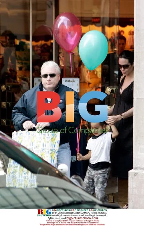 Pregnant Angelina Jolie Leaves Paris Hotel with Son