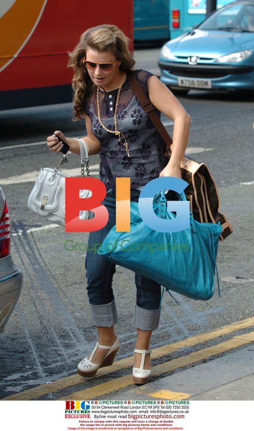 Coleen Mcloughlin Arrives with Luggage