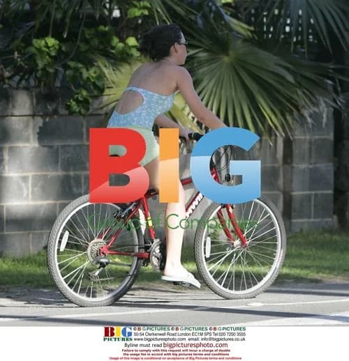 Evangeline Lilly rides bike to market in Honolulu