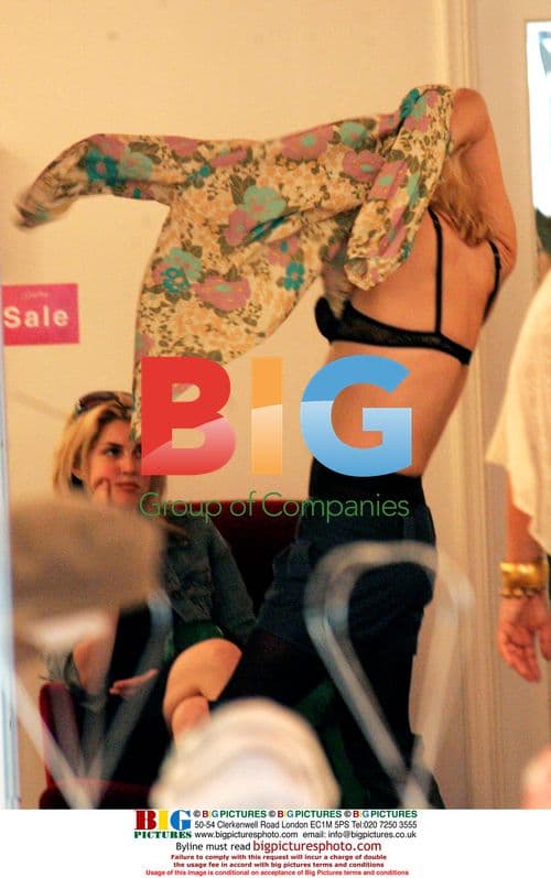 Courtney Love tries on clothes at LA boutique