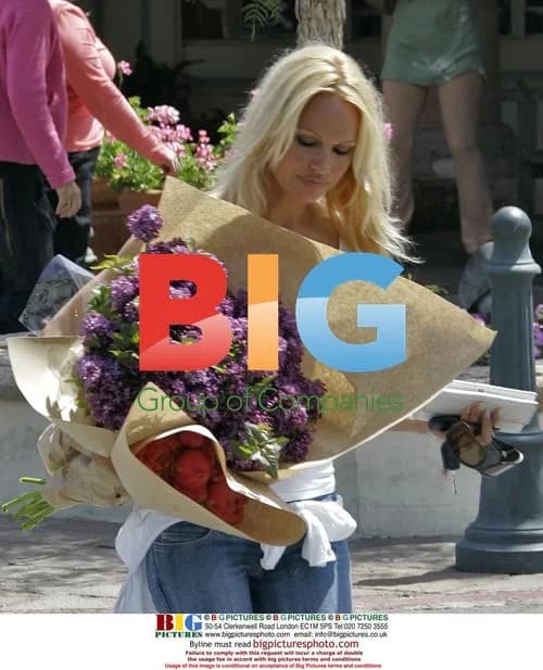 Pamela Anderson Busts Out with Flowers in Malibu