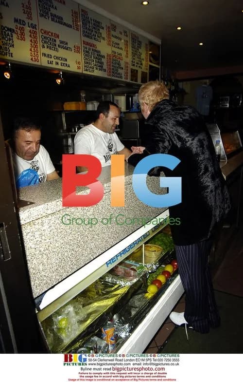 Chris Evans visits chip shop with a friend