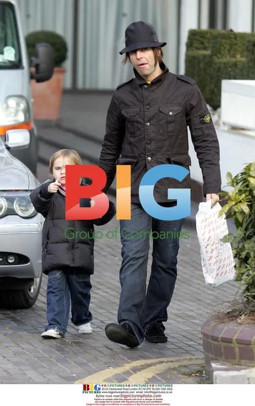 Liam Gallagher Carries Son Gene