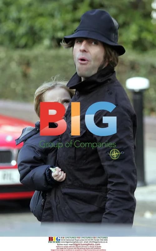 Liam Gallagher Carries Son Gene