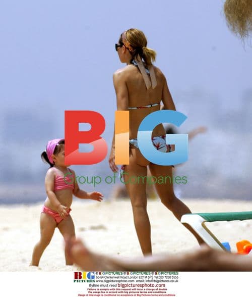 Michael Owen and family on beach in Portugal
