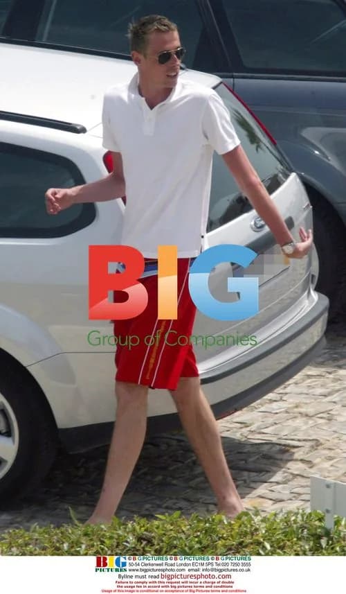 Peter Crouch crouching in car