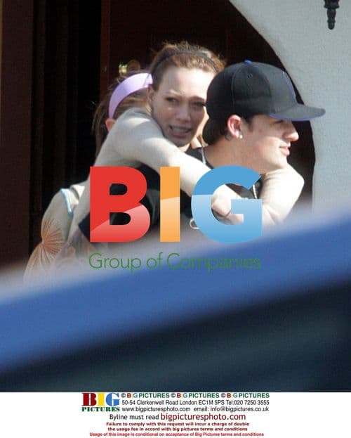 Joel Madden gives Hilary Duff a piggyback ride