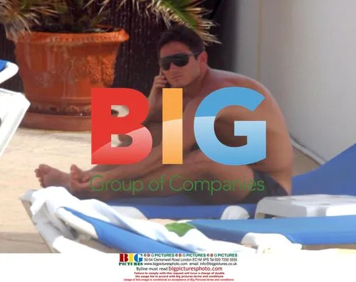 Frank Lampard sunbathing by pool in Algarve