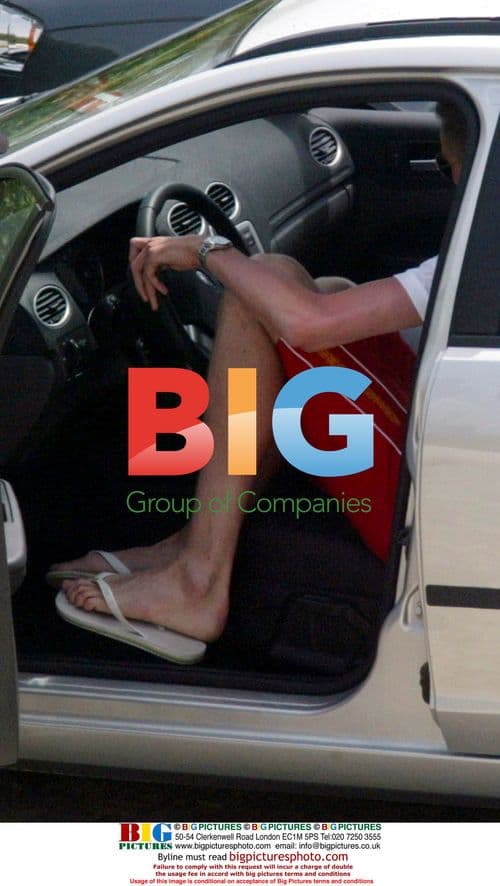 Footballer Peter Crouch fits into small car