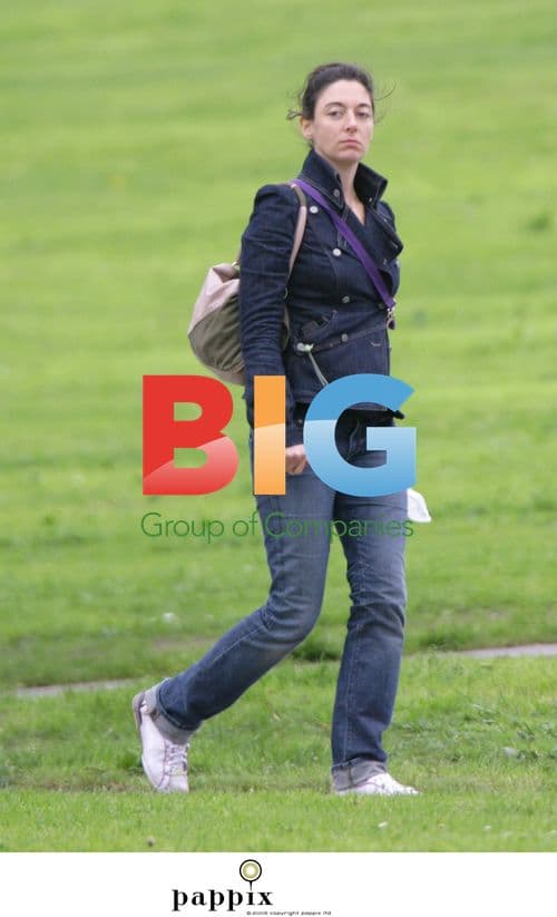 Paul McCartney's first child, Mary McCartney, walks dog