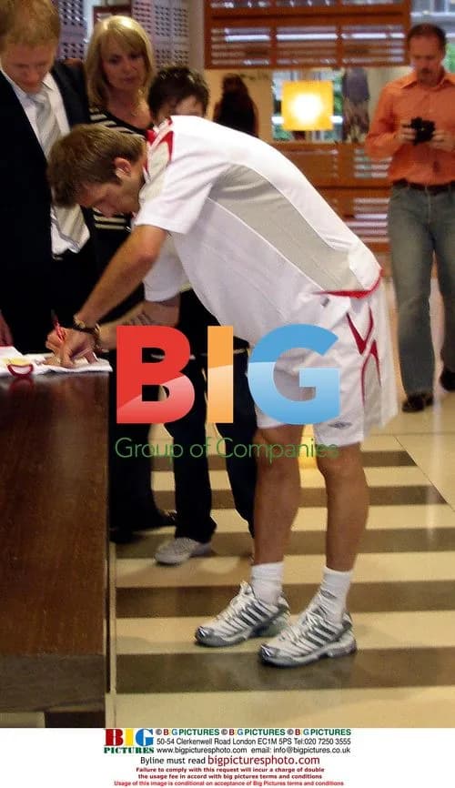 David Beckham Signs Autographs