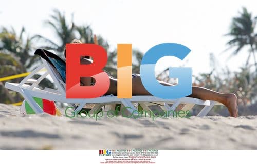 Javine Sunbathes on Beach Holiday