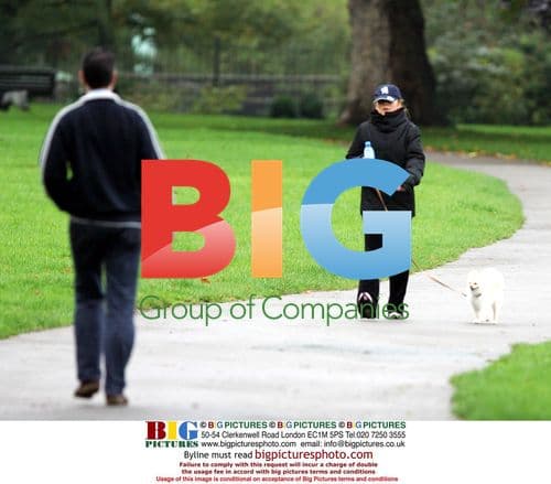 Geri Halliwell Strolling with Dog in Park