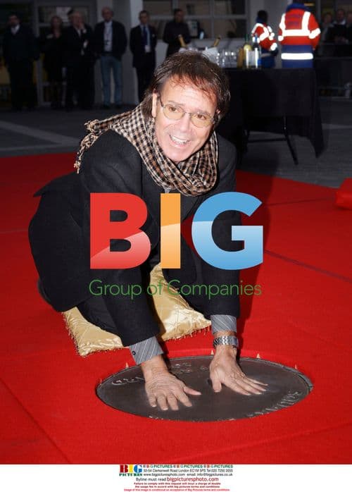 Sir Cliff Richards imprints hands in concrete