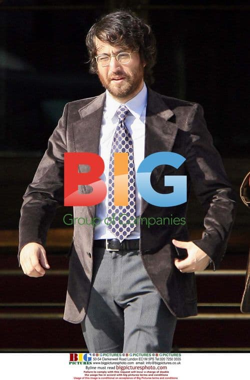 Sean Lennon Leaves Paris Hotel with Friend