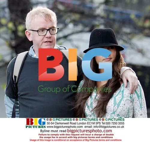 Chris Evans strolls in London with mystery woman