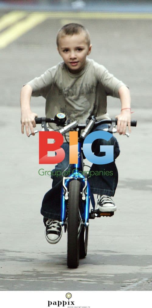 Madonna and Son Rocco Playing on Bike