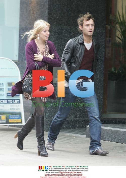 Jude Law and Sienna Miller walking in London